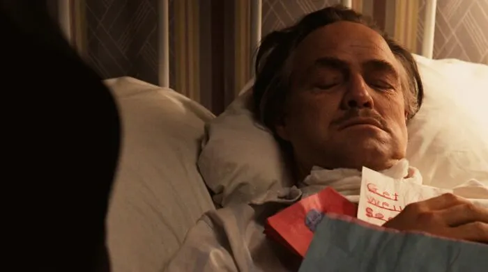 Don Vito Corleone sleeping in bed 