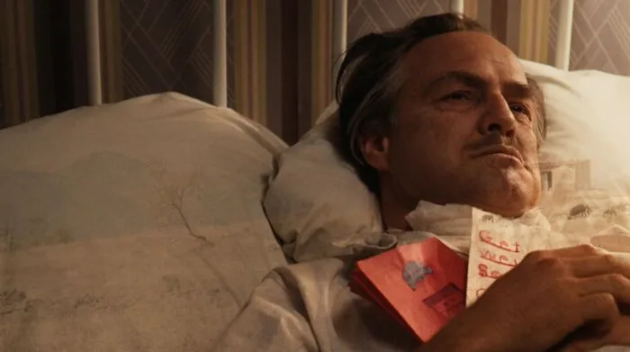 Don Vito Corleone ill laying in the bed 