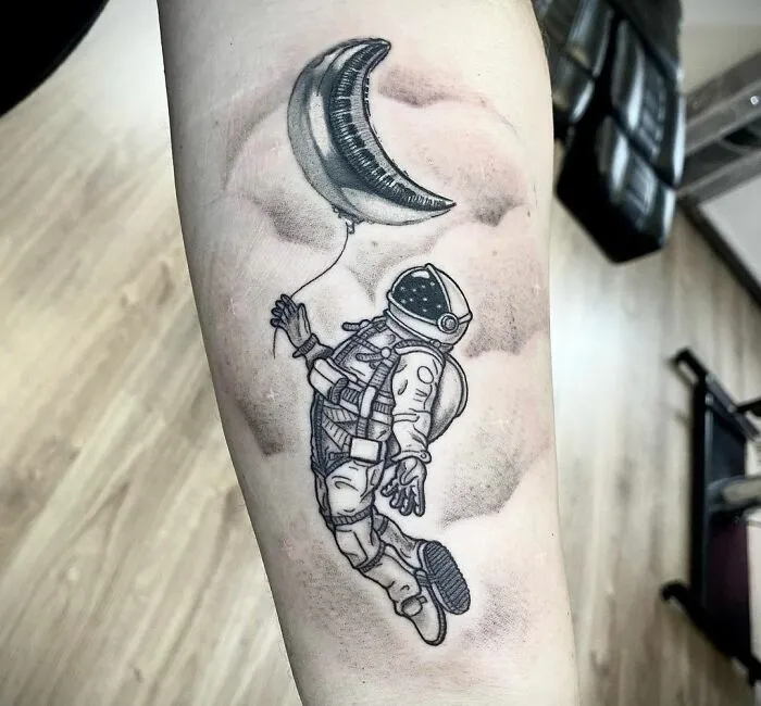 Astronaut Arm Tattoo