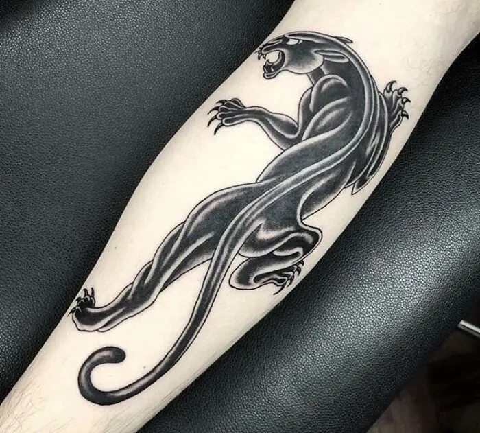 Black panther American traditional tattoo design on forearm.