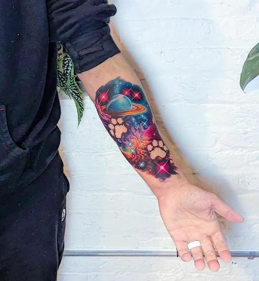 Colorful Space With Pet Footprints Forearm Tattoo