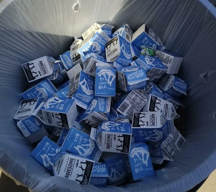 About Half Of This 50-Gallon Trash Can Is Full Of Perfectly Good Cartons Of Milk. Expiration Date Is In 2 Weeks. Schools Waste A Lot Of Food