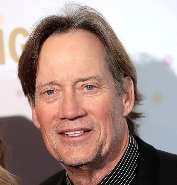 Kevin Sorbo, an actor who had an amazing career, smiles warmly at an event.