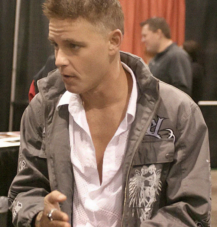 Actor Jeremy Jackson talking, wearing a gray jacket, who destroyed his amazing career.