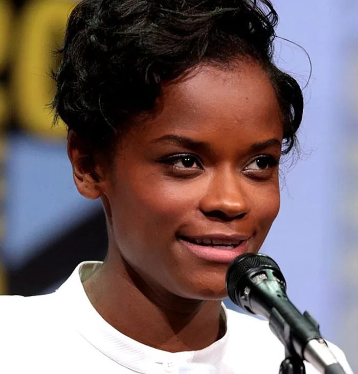 Letitia Wright, an actress, at a microphone, has an amazing career in the film industry.