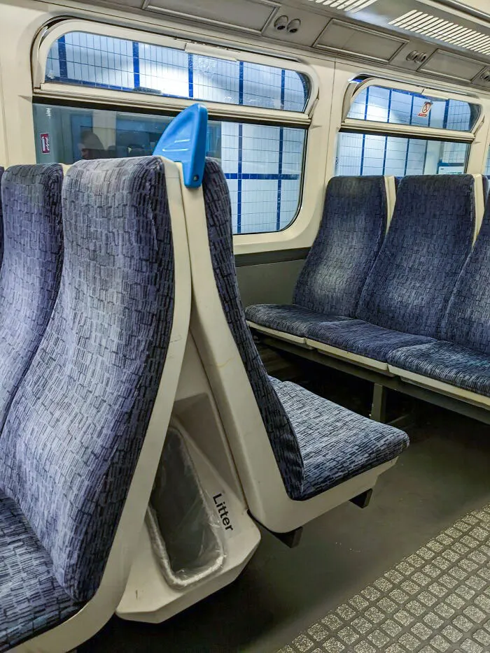 This Train Uses The Space Between Seats For Garbage
