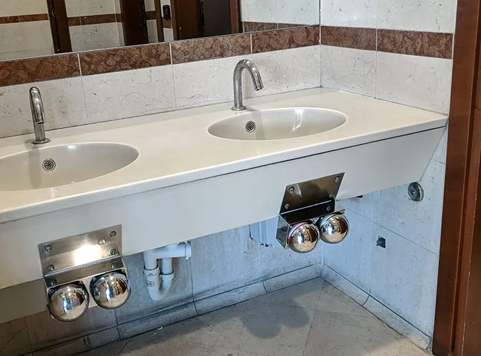 Knee-Activated Water Taps At A Supermarket In Italy