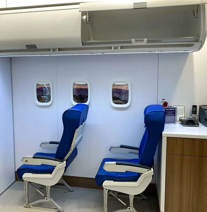 This Luggage Store Has An Airplane Set Up For Customers To Test Their Carry-Ons And Underseater Bags
