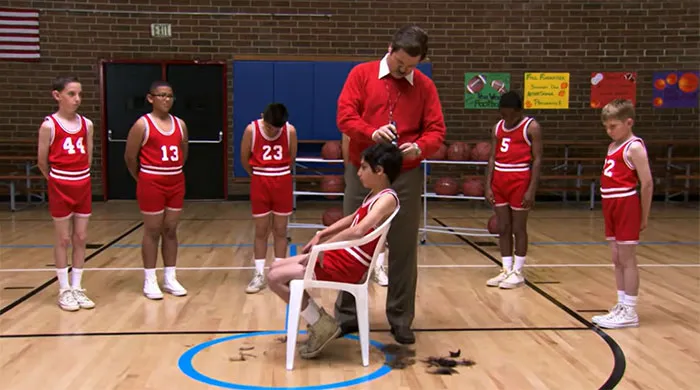 Ron Swanson cutting a child's hair in a gym while other kids in basketball uniforms watch, inspired by Ron Swanson quotes.