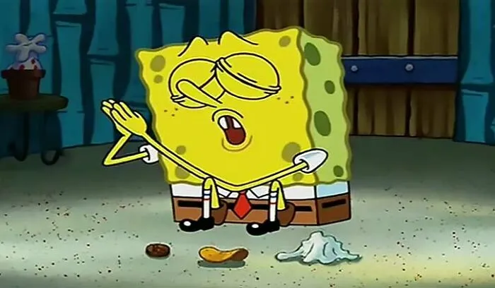 SpongeBob singing with eyes closed, seated on the floor with a penny, chip, and napkin, from iconic SpongeBob quotes.