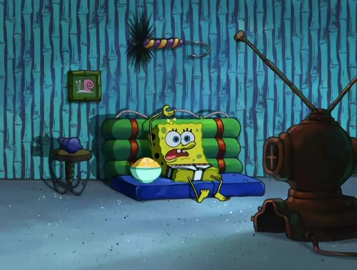SpongeBob sitting on a couch without pants, watching TV with popcorn, illustrating iconic SpongeBob quotes and moments.