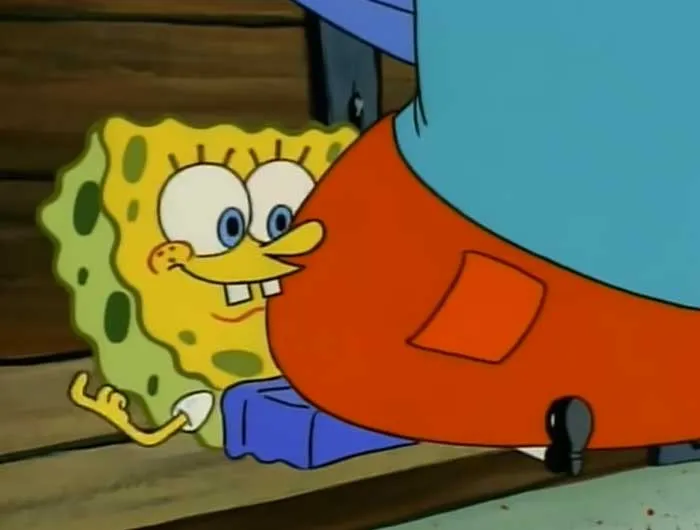 SpongeBob looking happy while sitting down, a scene related to iconic SpongeBob quotes you need to know.