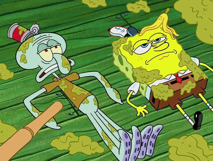 SpongeBob and Squidward covered in dirt lying on the ground, a memorable scene from iconic SpongeBob quotes.