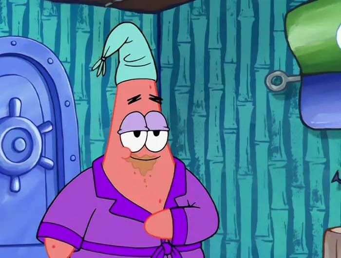 Patrick Star from SpongeBob SquarePants looking pleased with chocolate around his mouth, a classic SpongeBob quote moment.