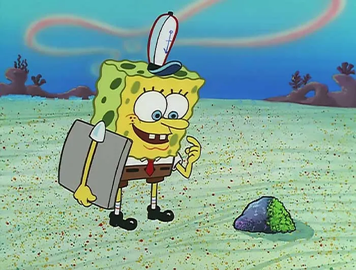 SpongeBob looking at a moss-covered rock under the sea, capturing a moment from iconic SpongeBob quotes.