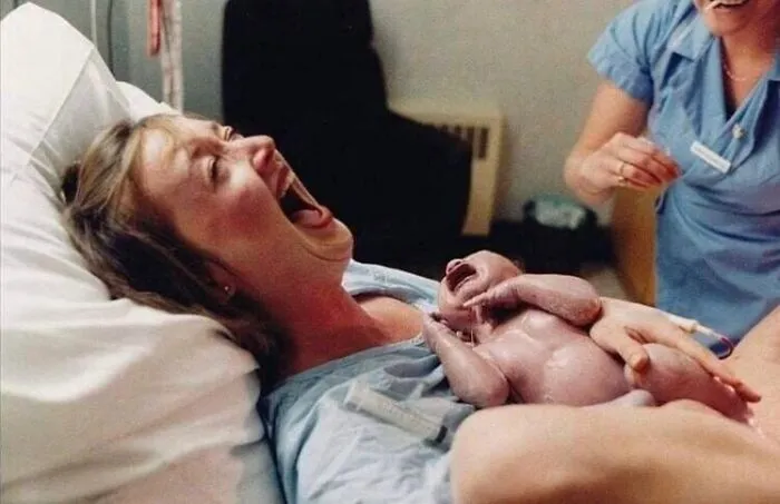 A Mother Laughs At Her Husband Who Just Fainted. 1986
