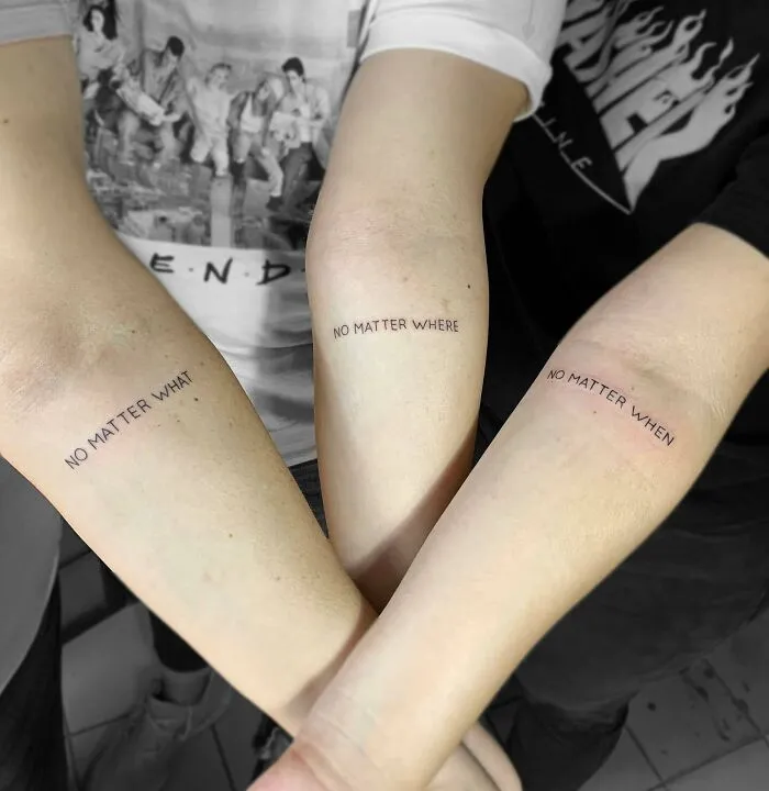 Three forearms with tattoos reading "No Matter What," "No Matter Where," and "No Matter When," symbolizing family bonds.