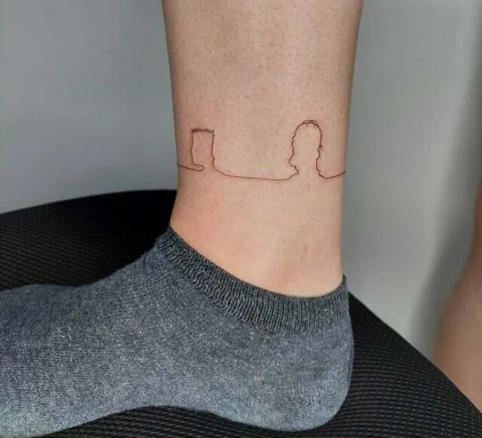 Minimalist family tattoo on ankle symbolizing unbreakable bonds.