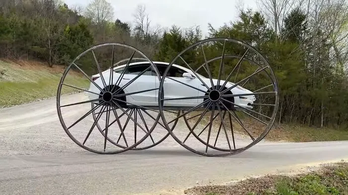 Tesla Model 3 With 10-Foot Wagon Wheels