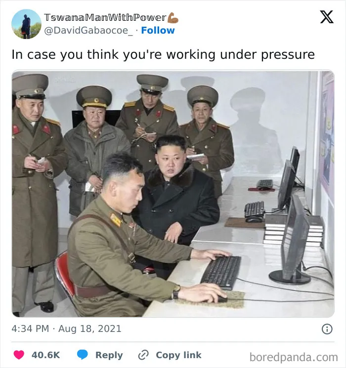 Military officials standing around at computers in an office, creating a funny work meme scene.