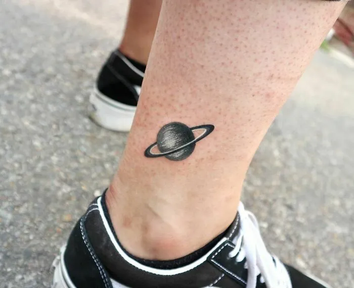 Gray Saturn Ankle Tattoo