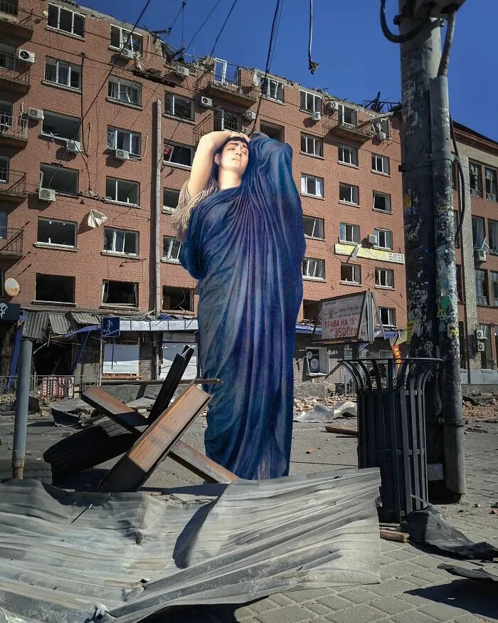 An image of a man from “Electra At The Tomb Of Agamemnon” painting in a ruined city of Kyiv