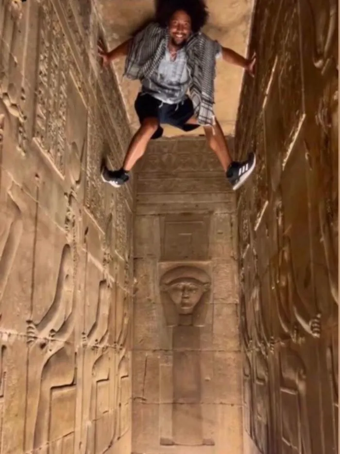 Tourist Scales Ancient Egyptian Antiquities