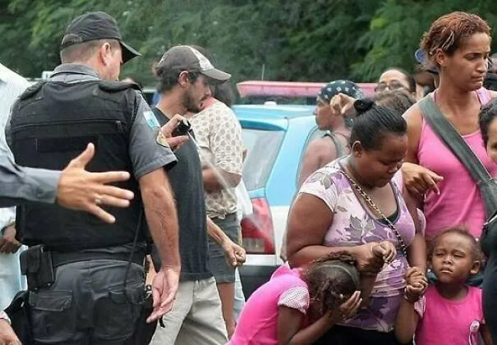 Police Officer Pepper Spraying Kid