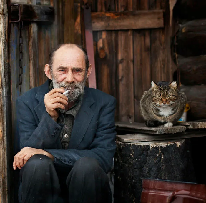 An Old Man With His Cat 