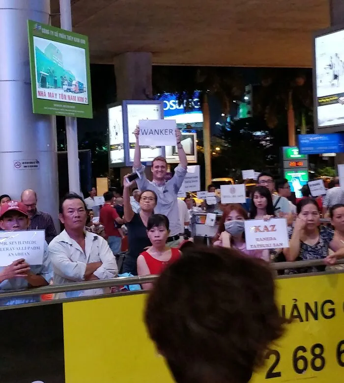 British Guy Here, Flew To Vietnam To Meet My Aussie Mate. Told Him I Wanted Him To Have A Sign For Me While Waiting For Me To Cross Through Customs. Guess Which One He Is