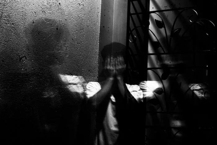 Man Covering Face With His Hands