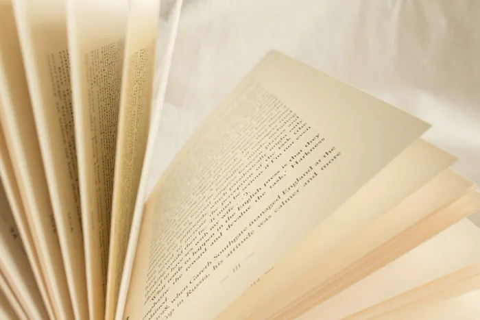 White book pages on white textile