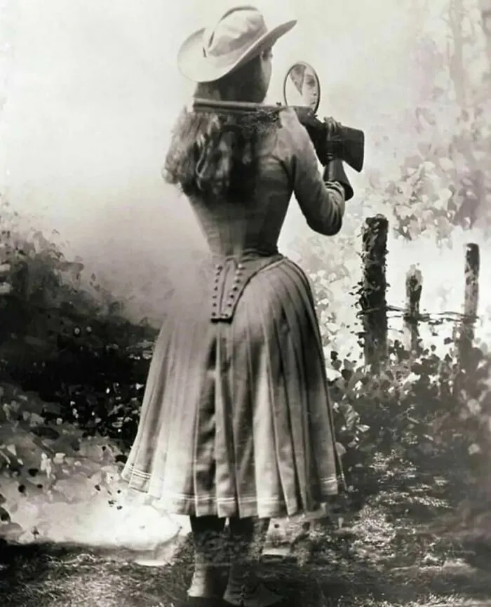 Sharpshooter, Annie Oakley Shooting Over Her Shoulder Using A Hand Mirror, 1899