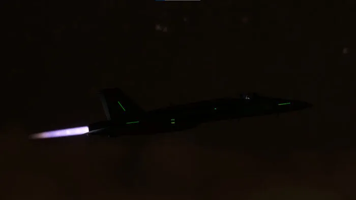 Side On View Of The F-18 With Lights And Afterburners