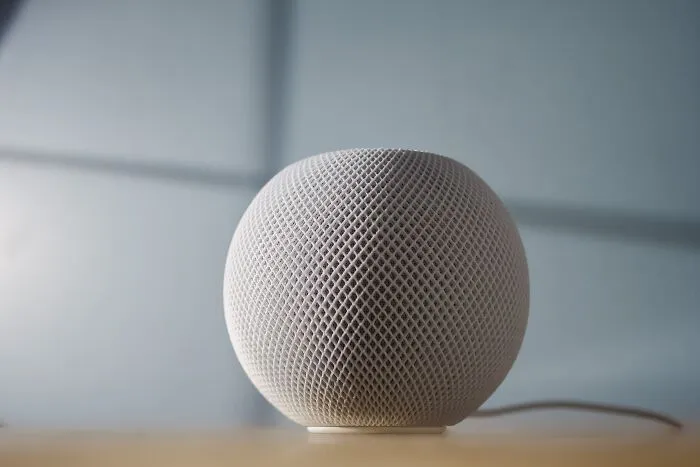A smart speaker on a table, evoking introspective shower thoughts.