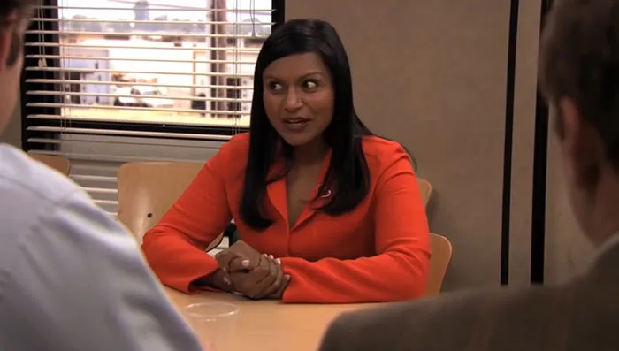Kelly Kapoor talking with her hands crossed 