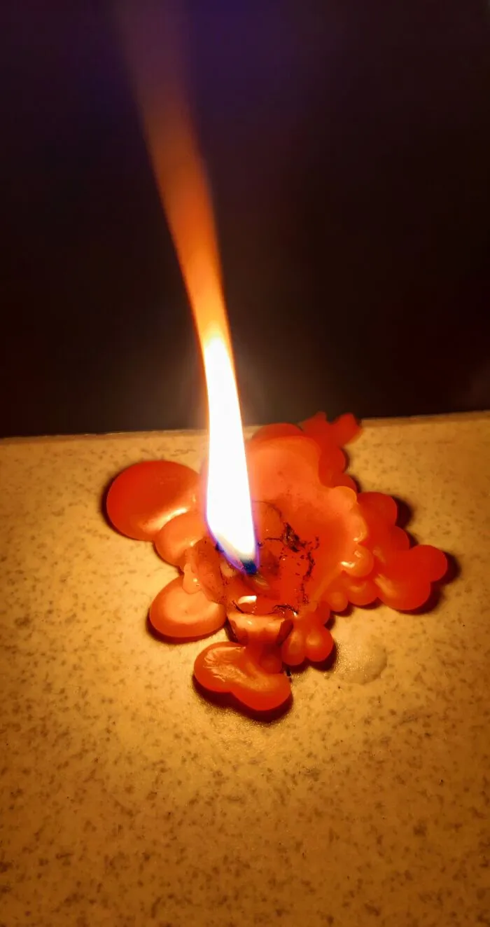 Burning Candle & Melted Wax
