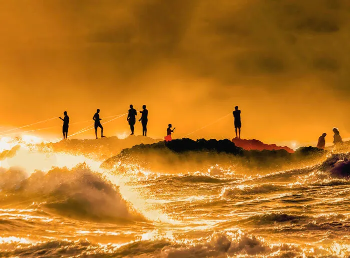 3rd Place In Nature/Sunrise/Sunset: "Braves Fishermen In The Rough Sea" By Hernani Castro Jr