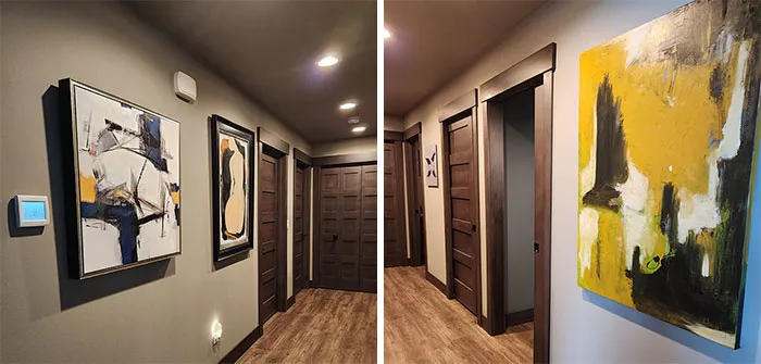 Hallway decorated with framed abstract paintings showcasing easy and creative wall art ideas for a stylish space.
