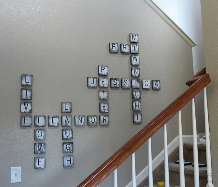 Scrabble tile wall art arranged near stairs, showcasing a creative and stylish space with easy wall art ideas.