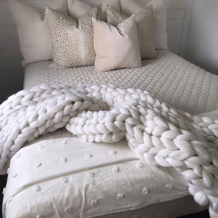 Chunky Knit Blanket: Made from 100% Merino Wool, perfect for creating a warm, cozy atmosphere on chilly nights or as an elegant bed runner.