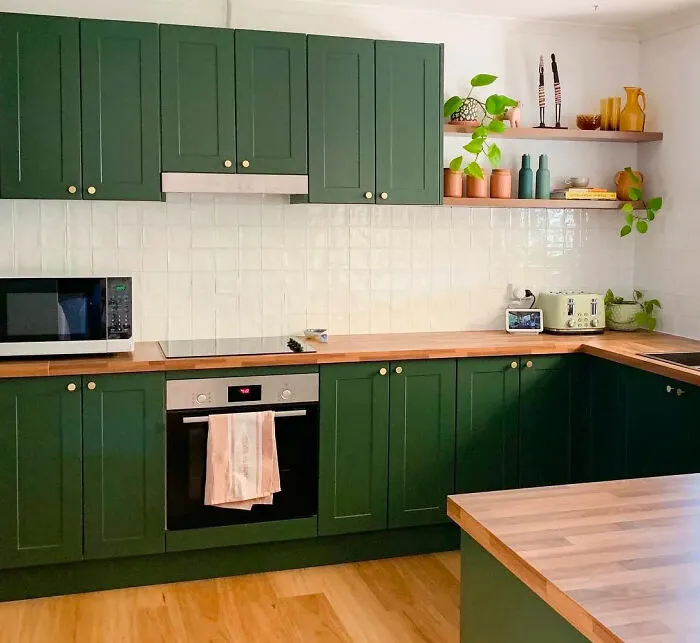 Warm Green Cabinets With Wood Accents