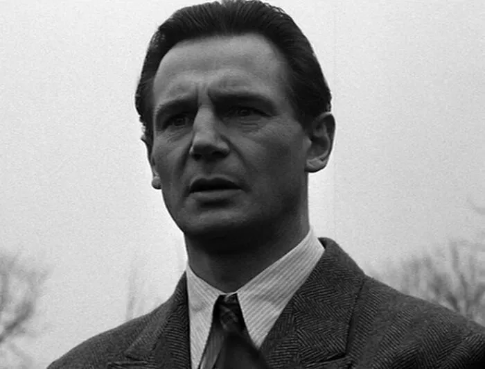 Oskar Schindler looking in Schindler's List