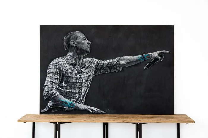 String art wall decor depicting a person pointing, showcasing creative wall art ideas for a stylish space.