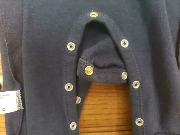 (X-Post) "The Middle Snap On My Baby's Onesie Is A Different Color To Help Align The Buttons."