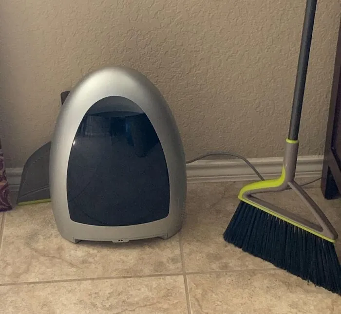 Silver air purifier and broom, perfect for your pre-2025 cleaning mission.