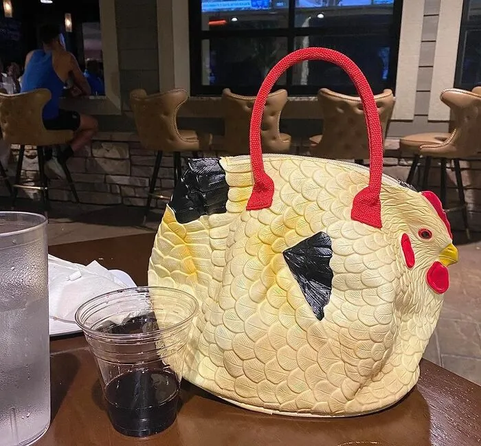 Ah! Who Needs Gucci, When You Can Have Poultry-Styled Passion, We Present You The One And Only - <a Style="Display:inline;" Href="Https://Www.amazon.com/Rubber-Chicken-Purse-Hen-Handbag/Dp/B001g8n95i?ie=utf8&linkcode=ll1&tag=bpcrab-20&linkid=c917134f6717bc30e70ab5809227fab6&language=en_us&ref_=as_li_ss_tl   " Target="_blank"><span Style="Font: Inherit; Color: #d74b1f;"> 'Hen Bag Handbag'</Span>. Flaunting Poultry Was Never So Trend-Setting!