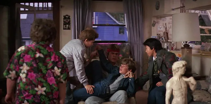 Five boys discussing in the room 
