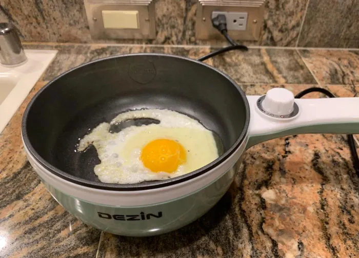 <a Style="Display:inline;" Href="Https://Www.amazon.com/Electric-Upgraded-Non-Stick-Temperature-Included/Dp/B07msdmt1g?crid=nri3e0va4tne&keywords=electric%2bpot&qid=1703255046&s=home-Garden&sprefix=electric%2bp%2cgarden%2c266&sr=1-2-Spons&sp_csd=d2lkz2v0tmftzt1zcf9hdgy&th=1&linkcode=ll1&tag=bplion-20&linkid=f5eae5c8b3d233b940cf89f25dc18660&language=en_us&ref_=as_li_ss_tl" Target="_blank"><span Style="Font:inherit;color:#d74b1f;"> Dezin Electric Cooker</Span> : The Gadget Perfect For Dorm Residents And Solo Travelers That Lets You Cook And Sauté Without A Stove, Promising Easy Clean-Up And Healthy Meals All While Being Compact And Energy Efficient!