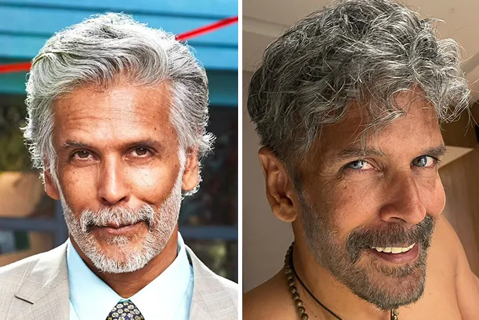 Older man with gray hair and beard, looking distinguished in a suit and casual in a necklace, redefining handsome.